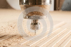 Close-up shot of machine with numerical control cuts wood. Cnc tool.