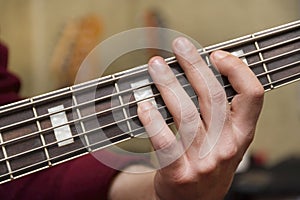 Close Up Shot Of Male Hand Playing Bass Guitar