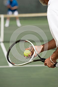 Close up shot of Male tennis player Preparing to Serve