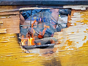 Close up shot of man grilling  food