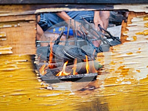 Close up shot of man grilling  food