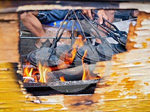 Close up shot of man grilling  food