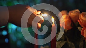 Close up shot of a man that lights candles. Valentines day. making a marriage proposal.