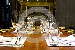 Close up shot of many glass drinkware in a modern restaurant