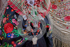Close-up shot of Maragatos dressed in their vibrant traditional clothing and jewelry