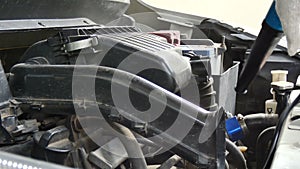 Close up shot mechanical using electric Blowers air force blowing to car engine filter for cleaning the dust with ambient sound