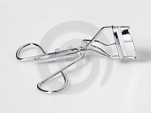 Close-up shot of metal eyelash curler