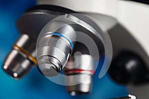 Close up shot of microscope lens in laboratory room