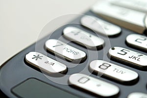 Close up shot of mobile keypad under light