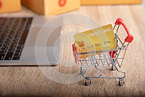 Close-up shot of mock up credit card in shopping trolley for e-commerce business