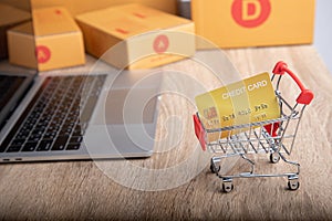 Close-up shot of mock up credit card in shopping trolley for e-commerce business