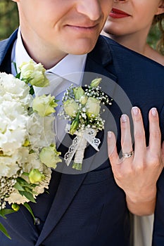 Close up shot of newlyweds embracing eachother. Just married husband and wife close up. Wedding and love concept. photo