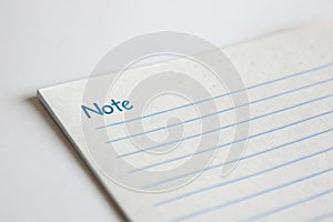 Close-up of a note paper on white background