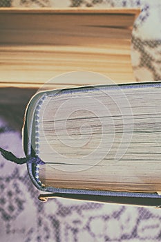 Close up shot of old books on a lace