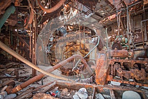 Close-up shot of an old rusty ship engine room.