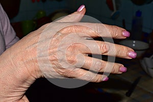 Close-up shot of old woman`s hand