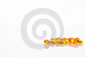 Close-up shot of Omega 3 fish oil capsules isolated on white background