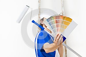 Close up shot of painter man showing a color palette