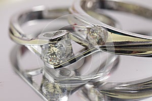 Close up shot of pair engagement /  mariage rings isolated photo