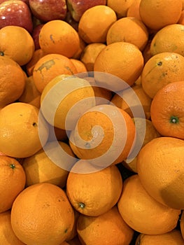 A close up shot pile of oranges freshly picked in traditional market