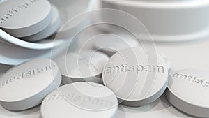 Close-up shot of pills with stamped ANTISPAM text on them. Conceptual 3D rendering photo