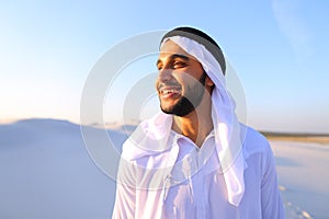 Close-up shot of portrait of happy sheik boy standing in middle