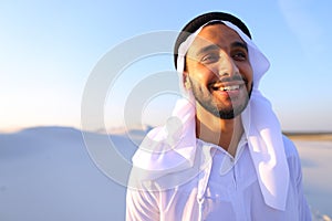 Close-up shot of portrait of happy sheik boy standing in middle