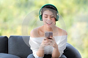 Close up shot portrait of young beautiful Asian woman sitting on