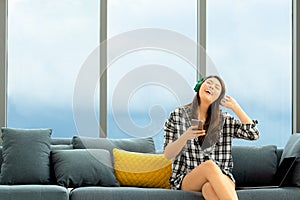 Close up shot portrait of young beautiful Asian woman sitting on