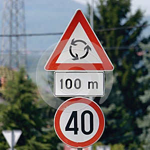 Close-up shot of the priority roundabout sign and the 40-speed limit