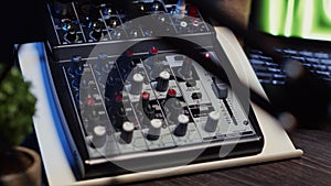 Close up shot of professional analog mixer able to produce impeccable sound