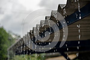 Close-up shot of rain from a rainstorm on the roof. Rainy season