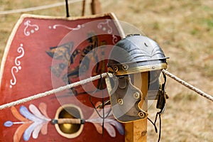 Close-up shot of a recreated Roman helmet and shield