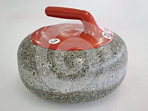 Close up shot of a red curling stone