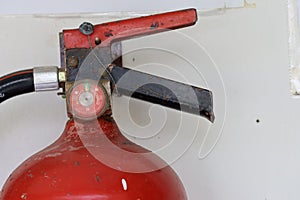 Close-up shot of red steel fire extinguisher with old model, concept for firefighting