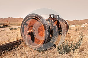 Rusty wheels on old farm equipment in the middle of prairies