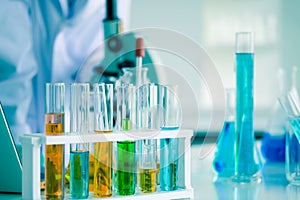 Close-up shot of science laboratory test tubes. Liquid many colors in equipment glassware for chemistry biology samples.