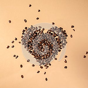 Close-up shot of scoop and roasted coffee beans spilled