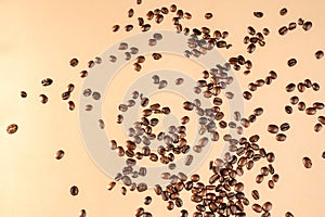 Close-up shot of scoop and roasted coffee beans spilled