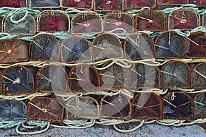 Close-up shot of seafood traps stacked in the harbor.