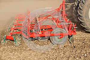 Close up shot of seedbed cultivator machine at work