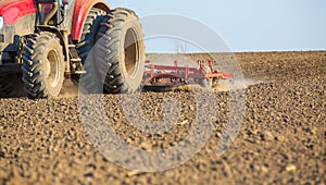 Close up shot of seedbed cultivator machine at work