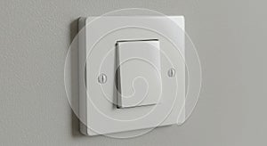 Close up of a white light switch on the wall