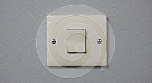 Electrical light switch on a wall