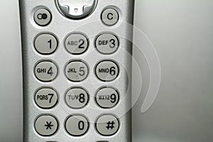 Close up shot of a silver cordless phone