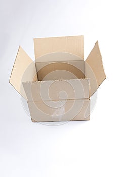  close up shot of a single open blank brown empty carton cardboard box on a white background