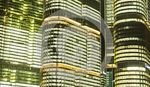 Close-up shot of skyscrapers illuminated at night