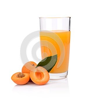 Close-up shot sliced orange apricots with juice and leaf