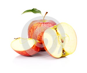 Close-up shot sliced red apple with leaf isolated