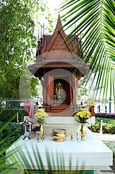 Close up shot of small temple model of buddhist spirit house in
